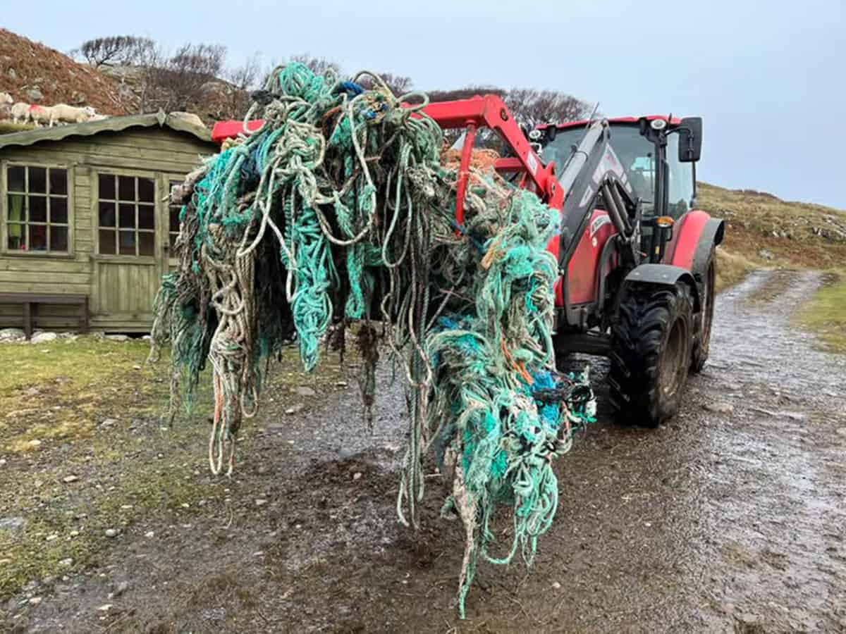 Tractor covered with rope hanging off at Inverpolly beach